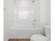 Close up of a pristine bathtub with integrated shelving and modern fixtures at 110 Browband St, Troutman, NC 28166