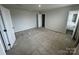 Bedroom with carpet and two doors, one leading to a closet, and another to a bathroom at 110 Browband St, Troutman, NC 28166