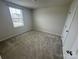 Bedroom with carpeted floors and natural light at 110 Browband St, Troutman, NC 28166