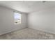 Cozy bedroom with carpet flooring and a window with natural light at 110 Browband St, Troutman, NC 28166