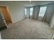 Carpeted bedroom with closet at 110 Browband St, Troutman, NC 28166