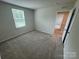 Bedroom with carpeted floors and natural light at 110 Browband St, Troutman, NC 28166