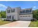 Charming two-story home with light gray siding, dark blue shutters, and a well-manicured lawn at 110 Browband St, Troutman, NC 28166