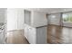 Kitchen island with granite countertops and white cabinetry offers extra prep space at 110 Browband St, Troutman, NC 28166