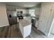 Modern kitchen featuring stainless steel appliances, granite countertops, and white cabinets at 110 Browband St, Troutman, NC 28166