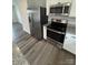 The kitchen has stainless steel appliances and plenty of granite counter space for food prep at 110 Browband St, Troutman, NC 28166