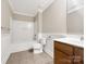 Bathroom with a single vanity, toilet, and tub-shower combination with white trim at 110 Colville Rd, Mooresville, NC 28117
