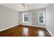 Bedroom boasts built-in shelving and storage, hardwood floors, and a ceiling fan at 110 Colville Rd, Mooresville, NC 28117