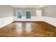 Spacious room with hardwood floors, wainscoting, and windows at 110 Colville Rd, Mooresville, NC 28117
