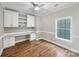 Home office with built in desk, shelving, and hardwood floors at 110 Colville Rd, Mooresville, NC 28117