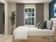 This cozy bedroom offers a comfortable bed, natural light and a stylish plant at 1102 Old Trade St, Edgemoor, SC 29712