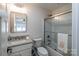 Modern bathroom featuring a vanity with granite countertop, framed mirror and a shower-tub combination at 1109 Bunch Dr, Statesville, NC 28677