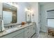 Bright bathroom with double vanity, granite countertop, modern fixtures, and enclosed shower at 1109 Bunch Dr, Statesville, NC 28677