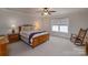 Bedroom featuring carpeted floors, a ceiling fan, and natural light from a window at 1109 Bunch Dr, Statesville, NC 28677