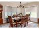 Bright dining room with chandelier, windows, and wood-style floors at 1109 Bunch Dr, Statesville, NC 28677