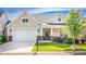 Charming home featuring a well-manicured lawn, stone accents, and an inviting covered front porch and two car garage at 1109 Bunch Dr, Statesville, NC 28677