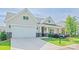Lovely home with a two-car garage, manicured lawn, and covered front porch at 1109 Bunch Dr, Statesville, NC 28677