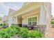 Inviting front porch with seating area and stone columns at 1109 Bunch Dr, Statesville, NC 28677