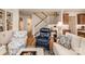 Cozy living room with hardwood floors, stairs, and comfortable seating at 1109 Bunch Dr, Statesville, NC 28677