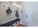 Functional mudroom with bench, hooks, and storage baskets at 1109 Bunch Dr, Statesville, NC 28677