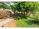 Street view showcasing mature trees, landscaping, and a glimpse of neighborhood charm at 1109 Bunch Dr, Statesville, NC 28677