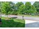 Street view showcasing a well-manicured lawn, mature trees, and a glimpse of neighborhood charm at 1109 Bunch Dr, Statesville, NC 28677