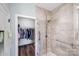 Bathroom featuring a tile shower with glass door and a view into a walk-in closet at 122 A Deer Brook Dr # A, Shelby, NC 28150