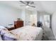 Bright bedroom showcasing a floral comforter, ceiling fan, and private bathroom at 122 A Deer Brook Dr # A, Shelby, NC 28150