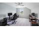Spacious bedroom with carpet, light paint, and a computer desk and office chair at 122 A Deer Brook Dr # A, Shelby, NC 28150