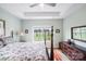 Bright bedroom features a floral comforter, hardwood floors, and a window with a view at 122 A Deer Brook Dr # A, Shelby, NC 28150