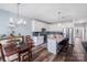 Open kitchen and dining area with an island, stainless steel appliances and hardwood floors at 122 A Deer Brook Dr # A, Shelby, NC 28150