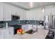Bright kitchen features white cabinets, stainless steel appliances, and quartz countertops at 122 A Deer Brook Dr # A, Shelby, NC 28150