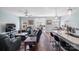 Open-concept living room featuring hardwood floors, comfortable seating, and a view to dining and kitchen areas at 122 A Deer Brook Dr # A, Shelby, NC 28150