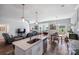 Spacious open-concept living area combining kitchen, dining, and living room with hardwood flooring at 122 A Deer Brook Dr # A, Shelby, NC 28150
