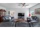 Comfortable living room with leather furniture and large windows at 122 A Deer Brook Dr # A, Shelby, NC 28150