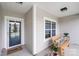 Inviting front porch with a cozy bench, wreath on door, and decorative plants, offering a warm welcome at 122 A Deer Brook Dr # A, Shelby, NC 28150