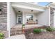 Inviting front porch with brick steps, a cozy bench, and decorative plants, offering a warm welcome at 122 A Deer Brook Dr # A, Shelby, NC 28150