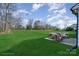Large lush backyard with patio furniture and a seating area at 1244 Bob Falls Rd, Shelby, NC 28150