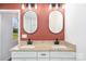 Bathroom with granite-topped vanity and dual sinks under modern lighting at 1244 Bob Falls Rd, Shelby, NC 28150