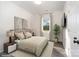 Bright bedroom with neutral decor, large window, and hardwood floors at 1244 Bob Falls Rd, Shelby, NC 28150