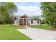Inviting single-story home with a long driveway and covered front porch, nestled on a lush green lawn at 1244 Bob Falls Rd, Shelby, NC 28150