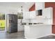Modern kitchen with white cabinets, stainless steel appliances, granite countertops, and an open layout at 1244 Bob Falls Rd, Shelby, NC 28150