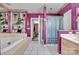 Spacious bathroom with soaking tub, glass shelving, and separate shower area at 129 Renaissance Pl, Statesville, NC 28625