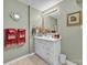 Bathroom showcasing a vanity with large mirror and decorative accents at 129 Renaissance Pl, Statesville, NC 28625