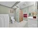Bathroom showcasing a toilet, vanity, and curtained shower, finished with neutral tiles at 129 Renaissance Pl, Statesville, NC 28625