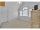 Bright bedroom featuring vaulted ceiling, neutral carpet, and natural light from window at 129 Renaissance Pl, Statesville, NC 28625