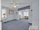 Cozy bedroom with blue walls, carpet, and a charming adjacent study area at 129 Renaissance Pl, Statesville, NC 28625