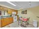 Kitchen with tile flooring, wood cabinets, and dining area at 129 Renaissance Pl, Statesville, NC 28625