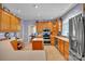 Traditional kitchen featuring wood cabinets, tile floors, and stainless steel appliances at 129 Renaissance Pl, Statesville, NC 28625