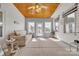Enclosed porch featuring concrete flooring, a neutral sofa, and natural light at 129 Renaissance Pl, Statesville, NC 28625